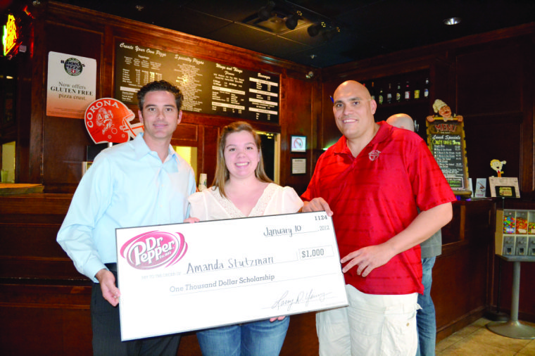 Barro's Pizza and Dr. Pepper present $1,000 checks